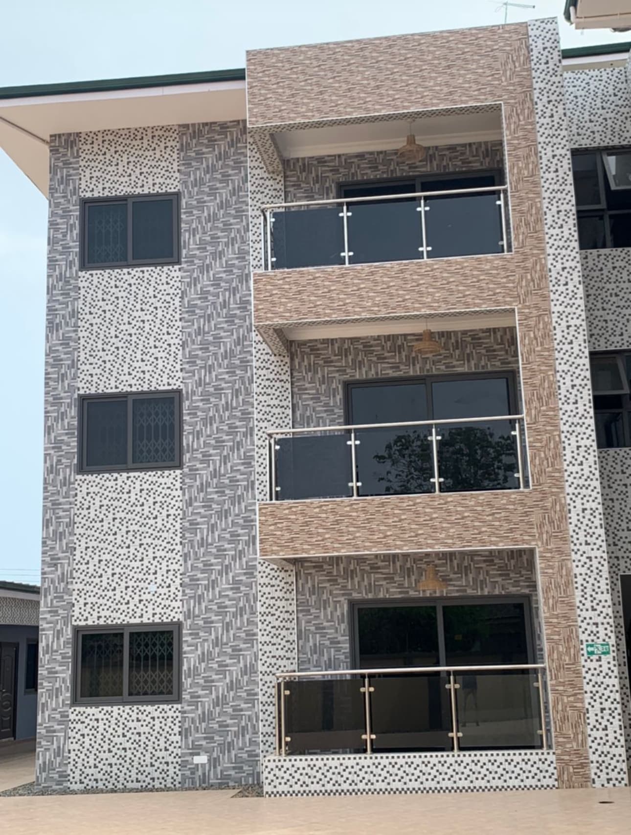Apartment balconies with stainless steel and tinted glass railings