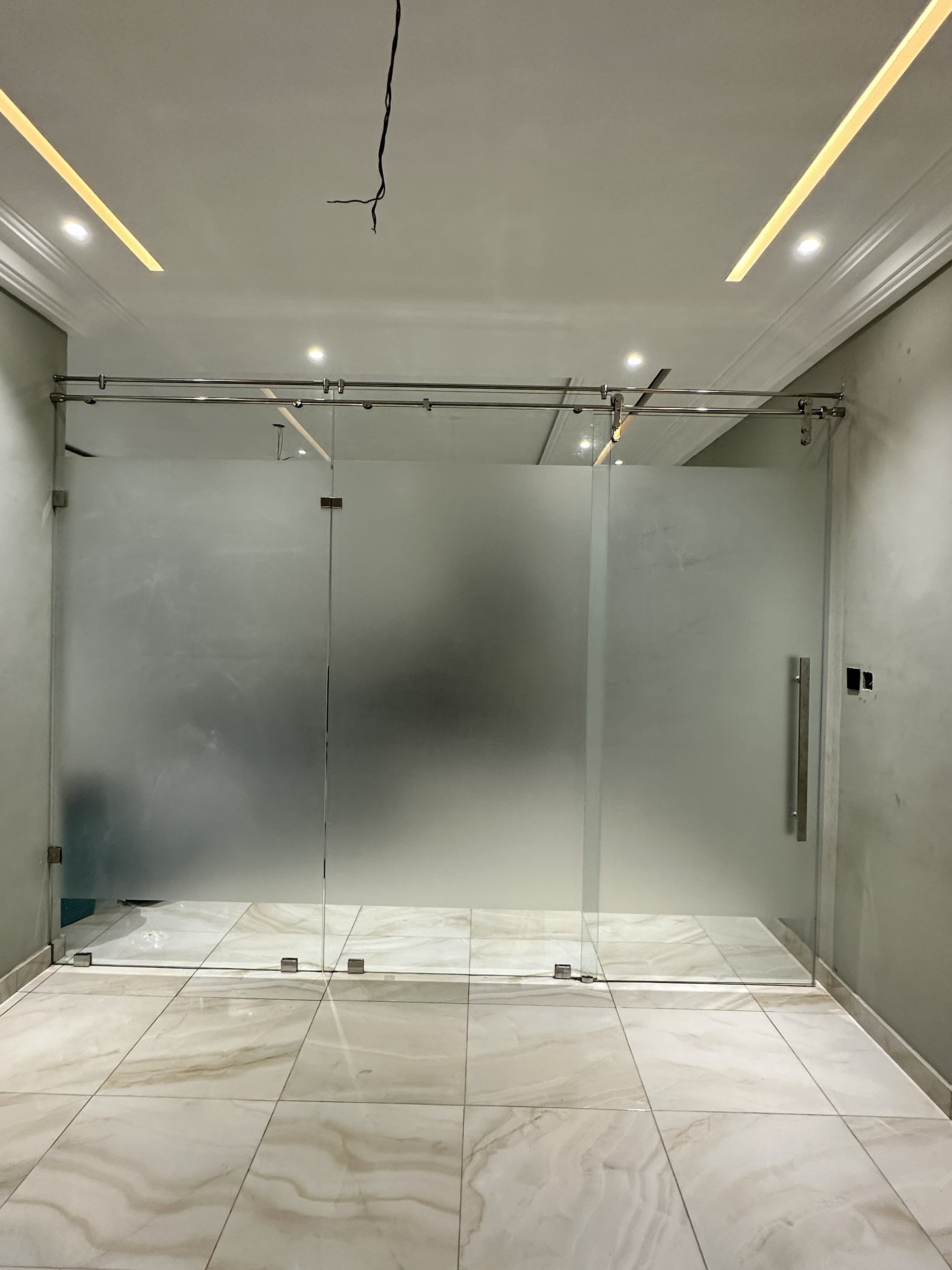 Full-height frosted glass partition wall