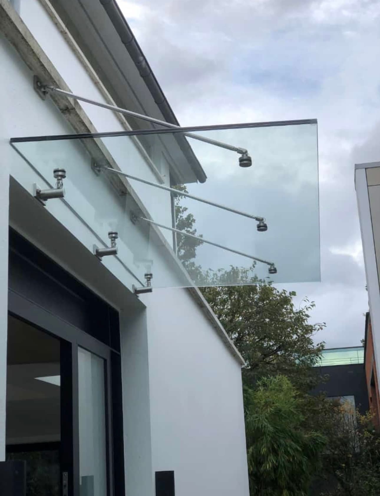 Cantilevered exterior glass entrance canopy
