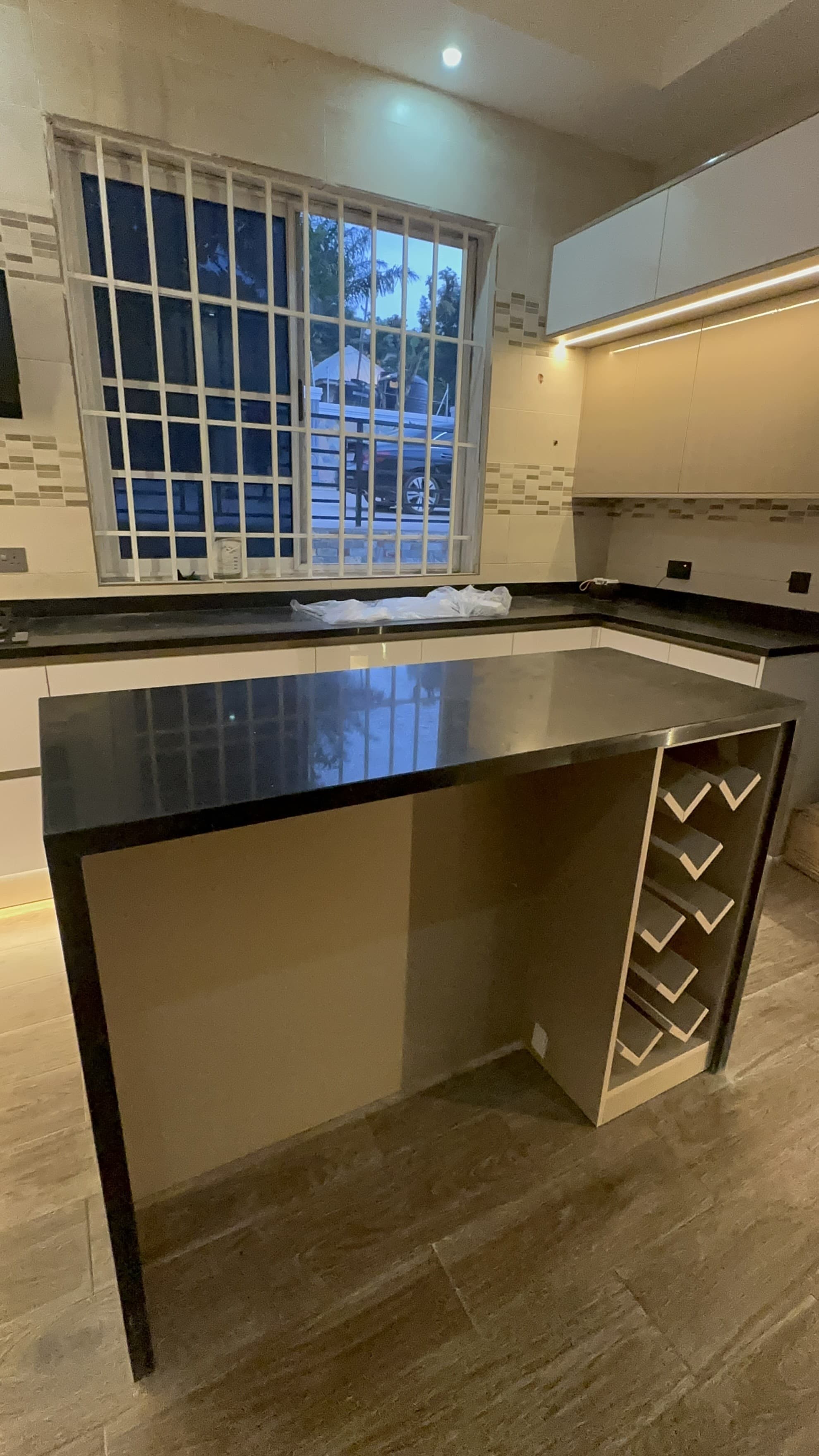 Modern kitchen island with black countertop