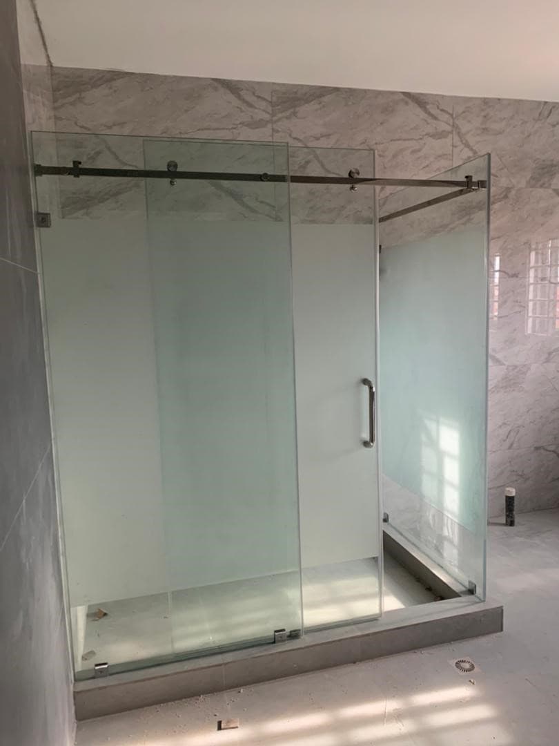 Frosted sliding glass shower enclosure