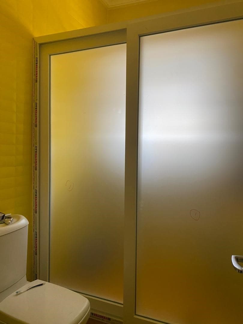 Framed frosted glass shower door