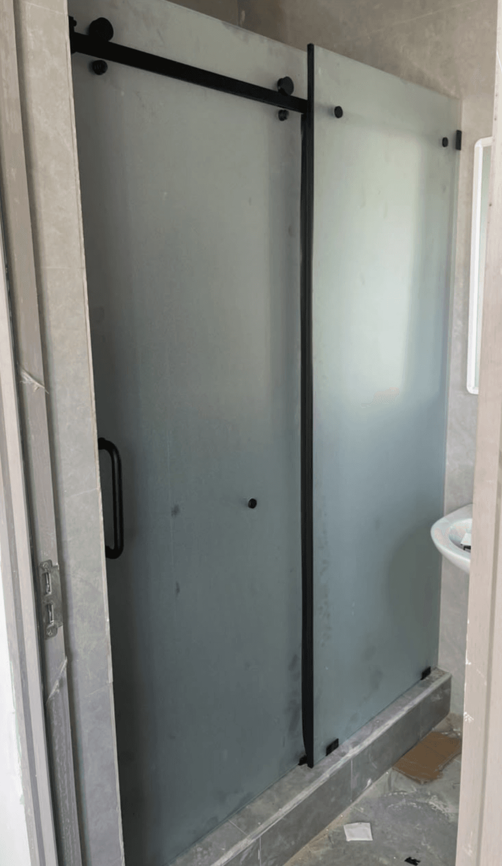 Frosted glass sliding door with black hardware