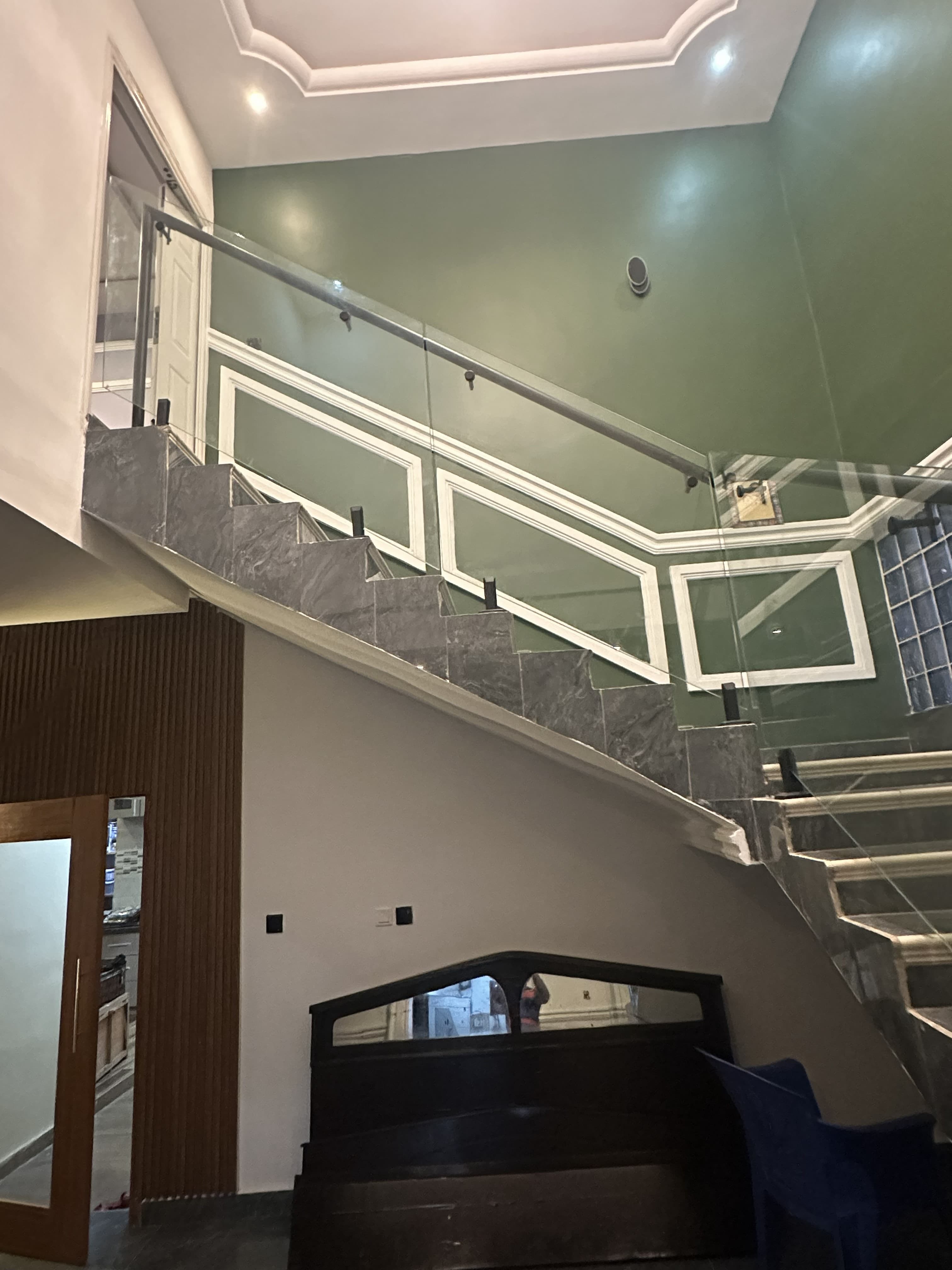 Classic interior staircase with glass railing