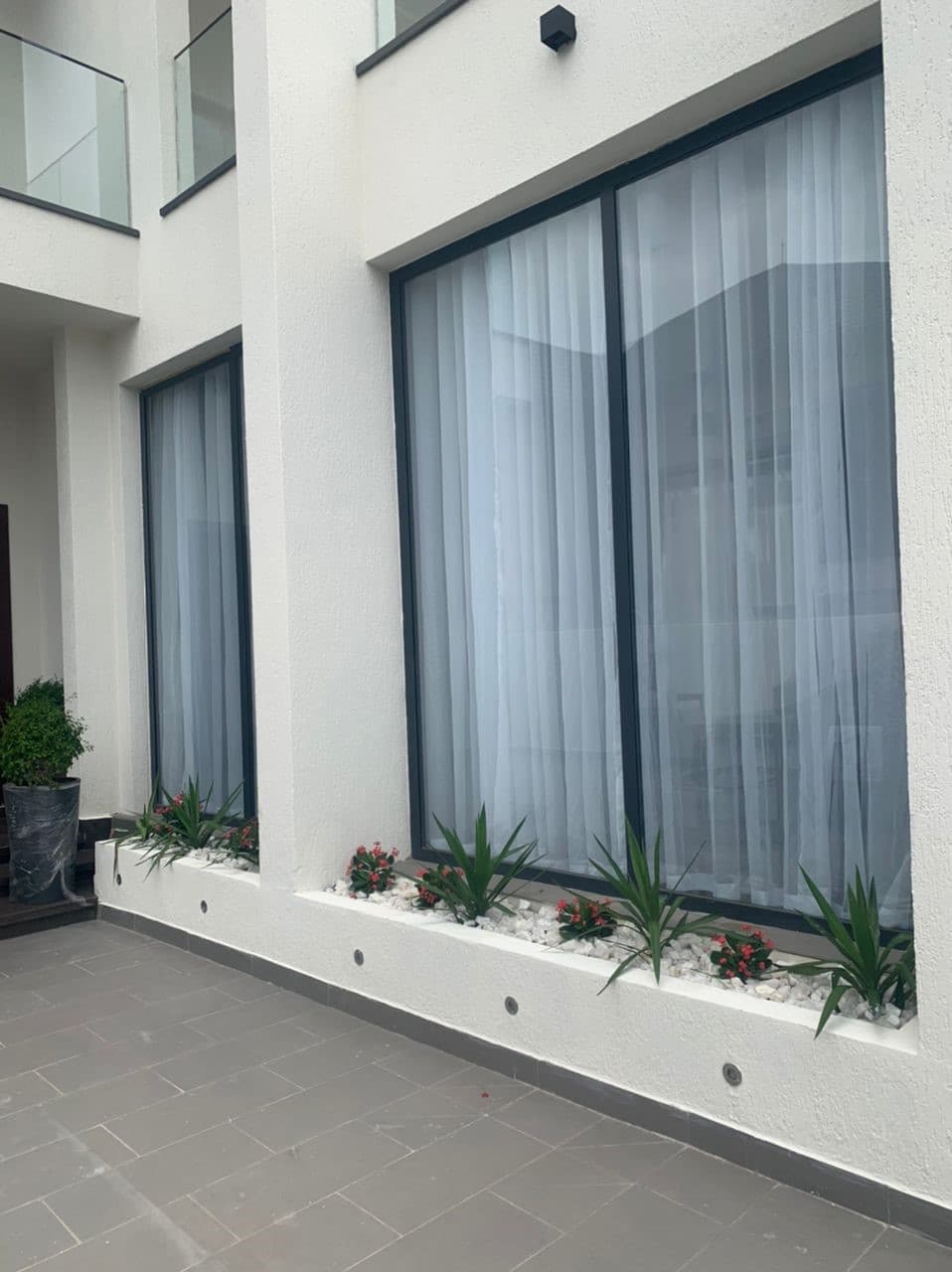 Floor-to-ceiling aluminum-framed glass windows
