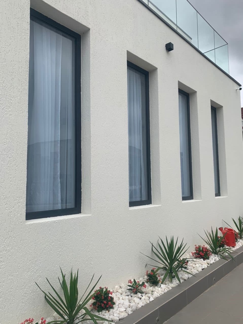 Vertical aluminum-framed exterior windows