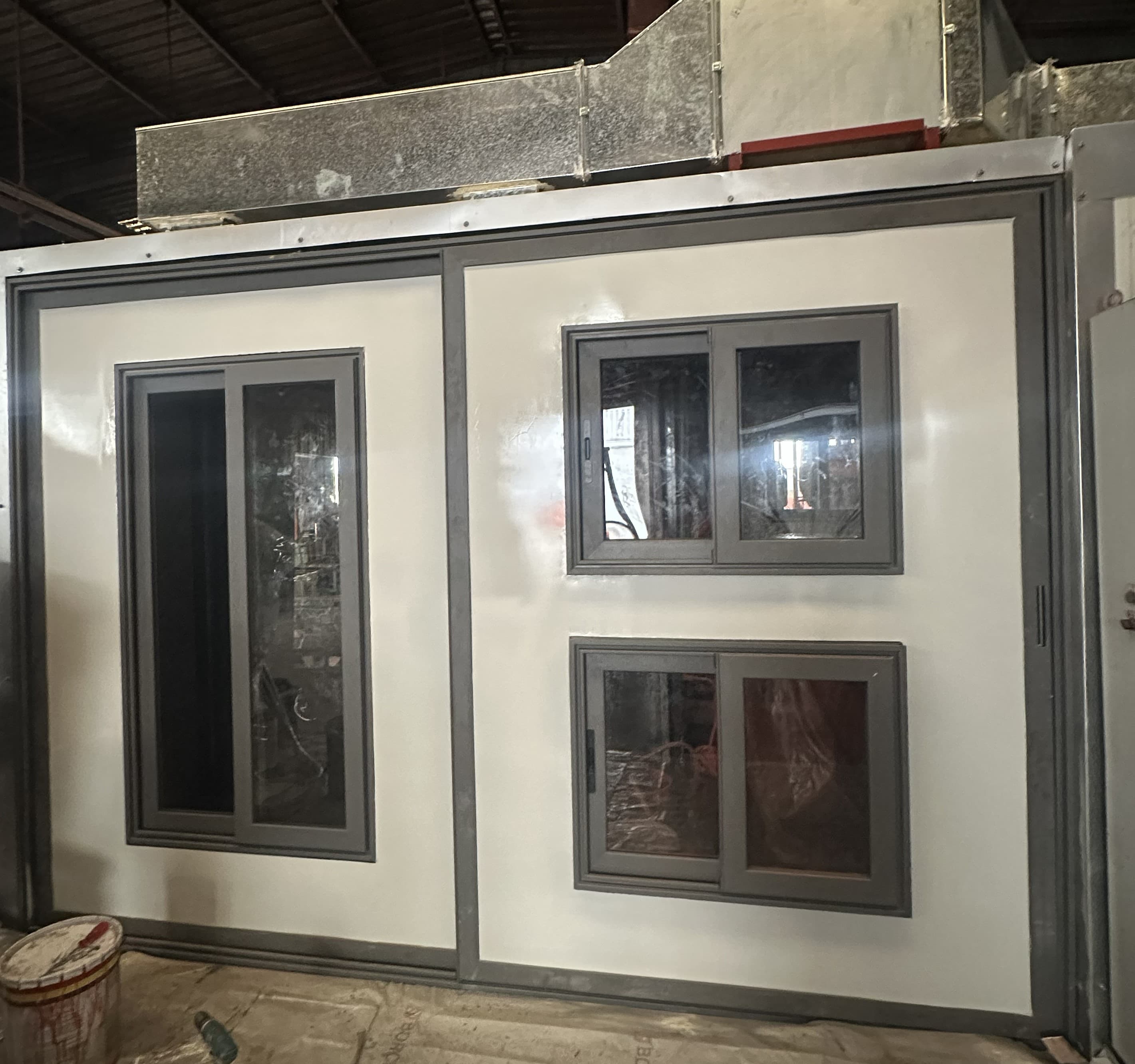 Modular wall panel with integrated sliding windows